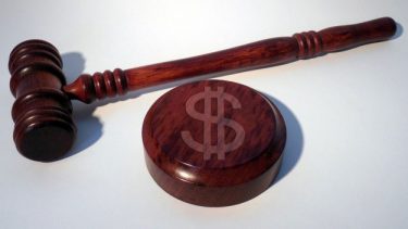 Gavel with dollar sign on marker