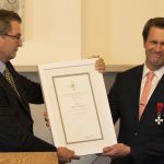 Andrew Nestingen (right), chair of the UW's Department of Scandinavian Studies, receives the Knight First Class of the Order of the Lion of Finland from Stefan Lindström, Finland's Los Angeles-based Consul General.