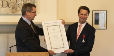 Andrew Nestingen (right), chair of the UW's Department of Scandinavian Studies, receives the Knight First Class of the Order of the Lion of Finland from Stefan Lindström, Finland's Los Angeles-based Consul General.