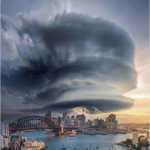 A Facebook post that shows a picture of a crazy cloud formation over Sydney. The text above the picture says "A friend posted this pic of last night's storm in Sydney. Think there might be a craft in there somewhere?"
