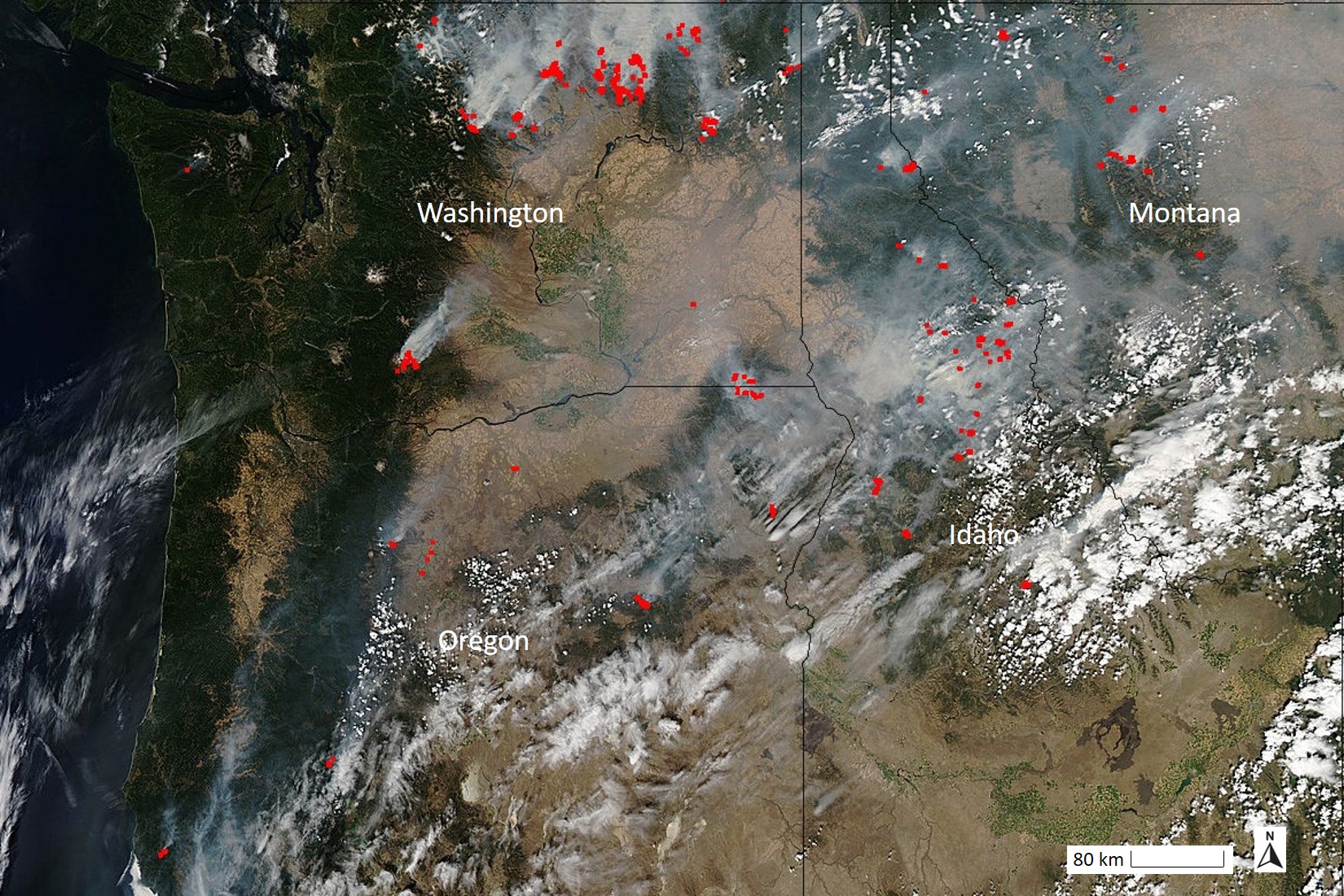 Red dots highlight the location of wildfires, all of which have white smoke coming from them 