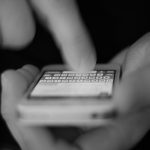 A closeup of a hand holding a phone