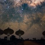 A picture of a radio telescope in Australia pointing up to the Milky Way