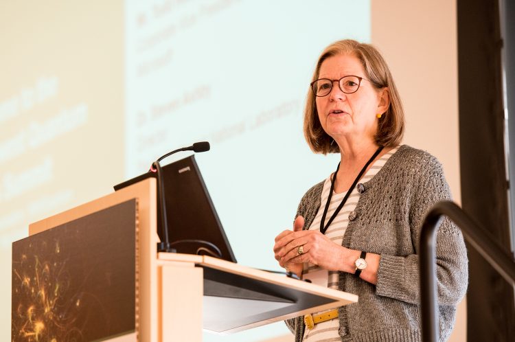 A person speaking at a lecturn