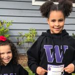 two girls with UW sweatshirts on
