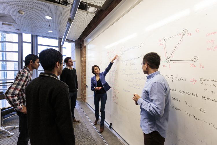 people at white board