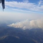 propeller with smoke plume in background
