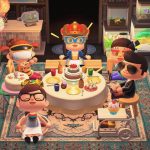 A screenshot of people gathered around a table in the game Animal Crossing. There are cakes and balloons and everyone is smiling.