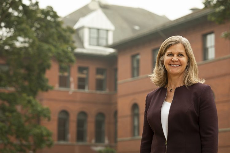 woman standing outside campus building