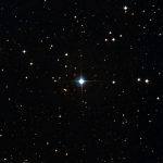 An image of stars in the night sky, showing a particularly bright binary at the center called HS Hydra.