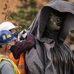 Workers with sculpture