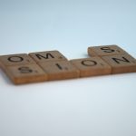 Scrabble tiles forming a word with one tile missing