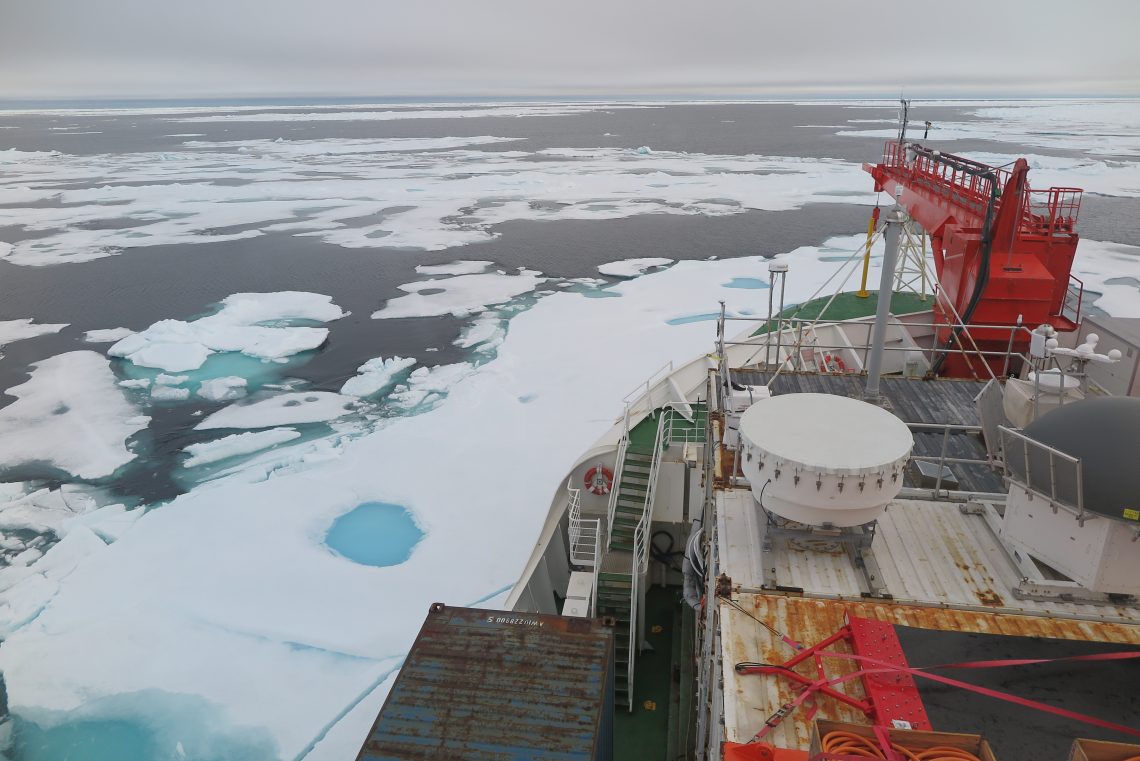 bow of ship with patches of ice and open water