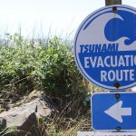 tsunami warning sign on the beach