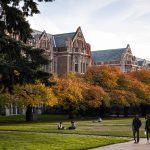 students walking across campus in the fall