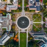 aerial view of large circular fountain on college campus