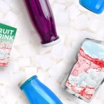 sugar cubes with fruit drinks laying on top