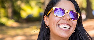 UW student wearing purple and gold sunglasses
