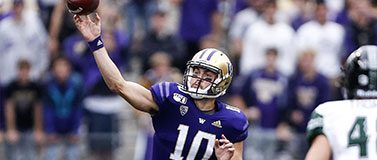 Husky quarterback Jacob Eason throws a pass against Hawaii.