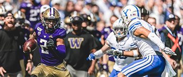 Aaron Fuller runs with the ball against a BYU defender