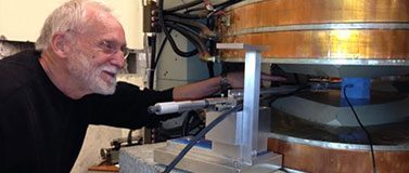 UW research engineer Erik Swanson with equipment used to measure magnetic fields in the Muon g-2 experiment.