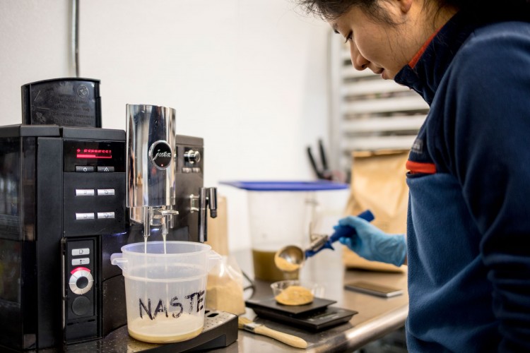Kathy Tuan brews espresso using white coffee beans, which are roasted more lightly than average beans for a different taste and more caffeine.