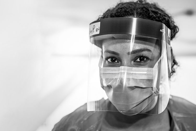 Medical worker wearing face mask and face shield