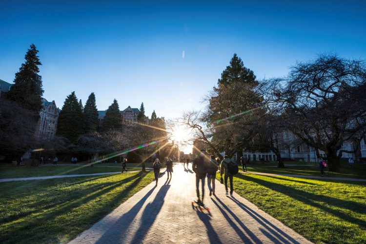 Students walk across the Quad on campus