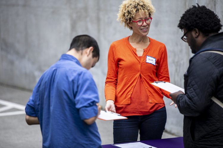 Wendy Barrington talks with visitors at a Doorway Project event.