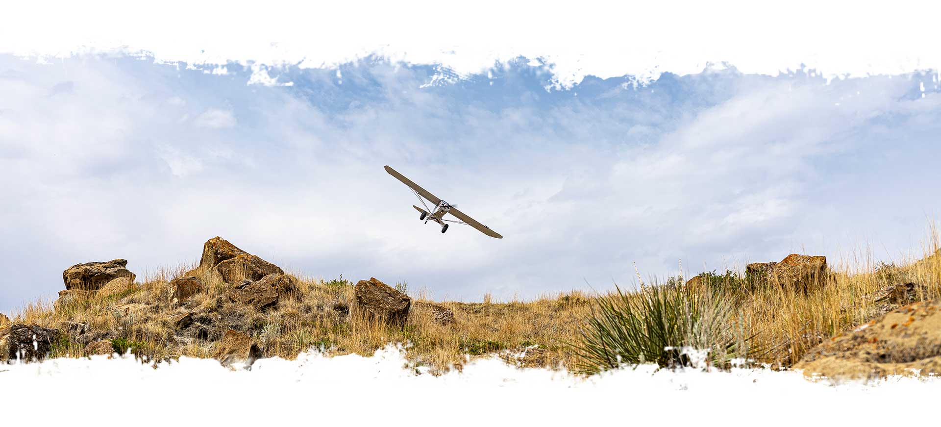 Plane flying above hillside