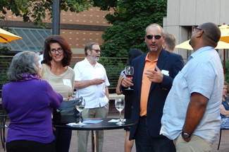 Huskies gather for a happy hour at the Oregon Historical Society in downtown Portland.