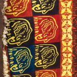 Colorful textiles from a craft village in Zambia featuring images of giraffe and zebra.