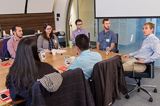 Recent graduates share their career journey as part of an employee panel.
