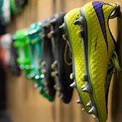 Soccer shoes are hanging on the wall