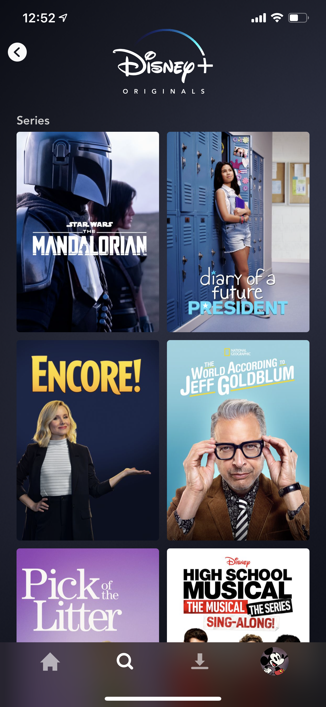 Example of App Design for iOS with the following features: content (image dominant), grid, search, tab bar, card, icon button. App by DisneyPlus (iPhone X)