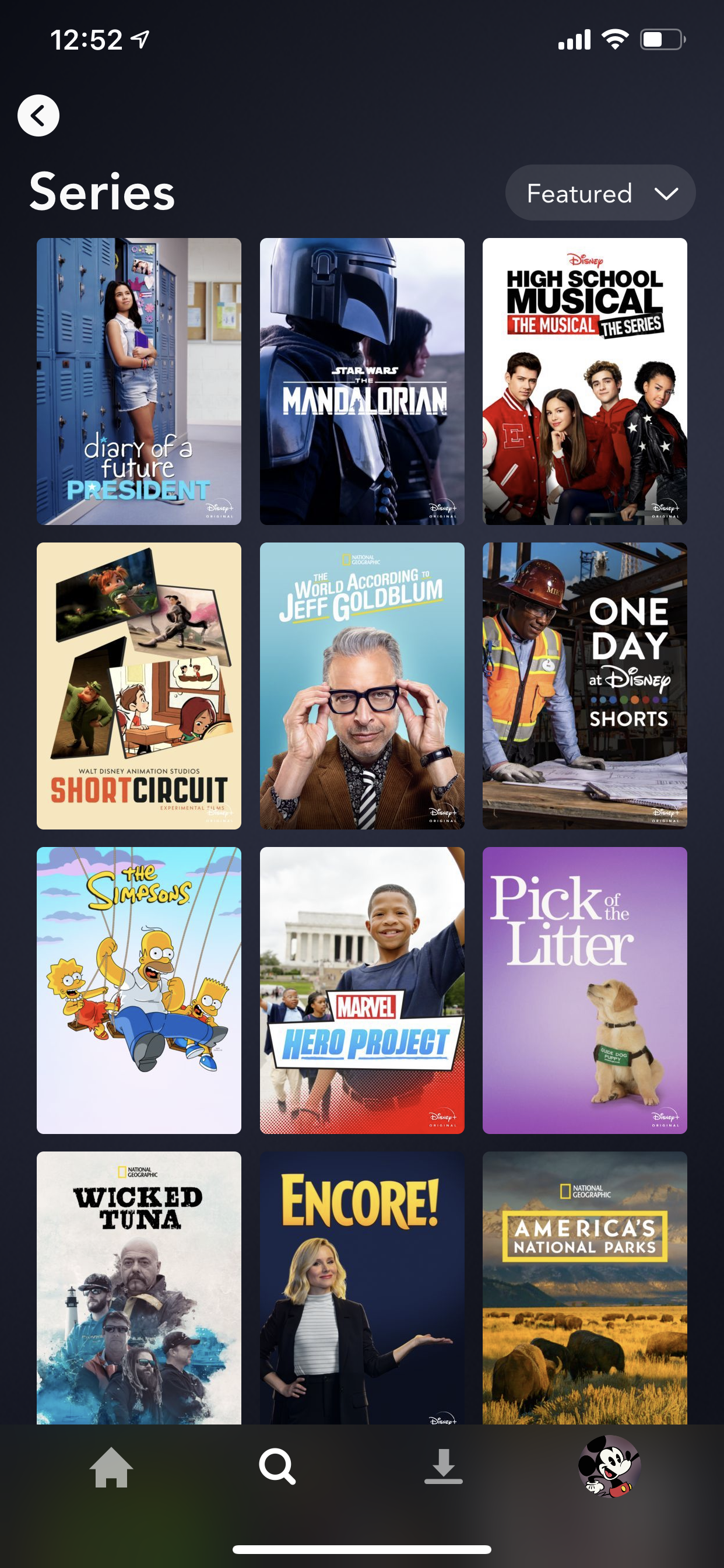 Example of App Design for iOS with the following features: content (image dominant), grid, navigation ~ menu, search, tab bar, card, icon button, dropdown. App by DisneyPlus (iPhone X)