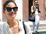 Walk on the wild side: Victoria's Secret model Lily Aldridge shops the NYC jungle in tiger print scarf and flats 