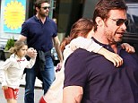 Don't mess with Wolverine! Fun piggyback ride doubles as a protective mechanism as Hugh Jackman keeps his daughter Ava close following absurd stalker incident 
