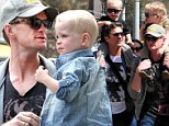 Spring stroll: Neil Patrick Harris and longtime partner David Burtka gave their fraternal twins piggyback rides on Tuesday while out and about in New York City