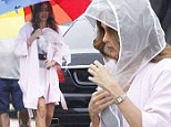 Stormy skies: Sofia Vergara wears a headscarf and carries an umbrella in New Orleans 