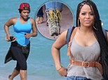 Working up an appetite! Christina Milian flashes some serious curves during a beach workout before hitting the streets of Miami