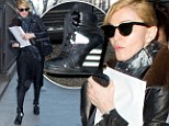 She'll always be a fashion risk taker! Madonna pairs platform wedge boots with bizarre billowing pantaloon trousers 