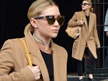 Fashion victim! Ashley Olsen�s tiny frame is swamped by masculine coat as she steps out in unflattering ensemble