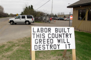 A pro-labor sign is posted outside the entrance of the American Crystal Sugar Co. plant in Moorhead, Minn., Monday, April 2, 2012