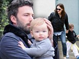 Stay dry baby! Ben Affleck shields son Samuel from the rain in Los Angeles... while mom Jennifer Garner runs after their girls across town