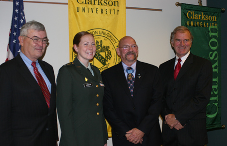 U.S. Army Cadet Mickala S. Henson received a $3,000 scholarship from the Armed Forces Communications and Electronics Association (AFCEA) Educational Foundation and the Congressional Medal of Honor Foundation. This award is presented annually to four outstanding students nationwide, one from each of the Reserve Officer Training Corps (ROTC) for the Army, Air Force, Navy, and Marine Corps. Shown above from left to right are retired Lieutenant General Nicholas Kehoe, President of the Congressional Medal of Honor Foundation, Cadet Henson, Gary B. Beikirch, a Medal of Honor Winner from the Vietnam War, and Clarkson President Tony Collins.
