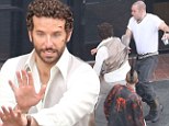 'Just don't ruin the hair!' Perm sporting Bradley Cooper films fight scenes with small army of punks for latest movie 