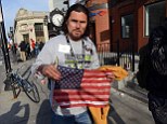 Hero: A badly shaken Carlos Arredondo, who was at the finish line of the 117th Boston Marathon when two explosives detonated