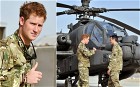 Prince Harry gives a thumbs up after he walked passed the Apache flight-line at Camp Bastion in Afghanistan, where he will be operating from during his tour of duty as a co-pilot gunner