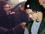 Pandemonium: Harry Styles looked sad as he arrived in Nice